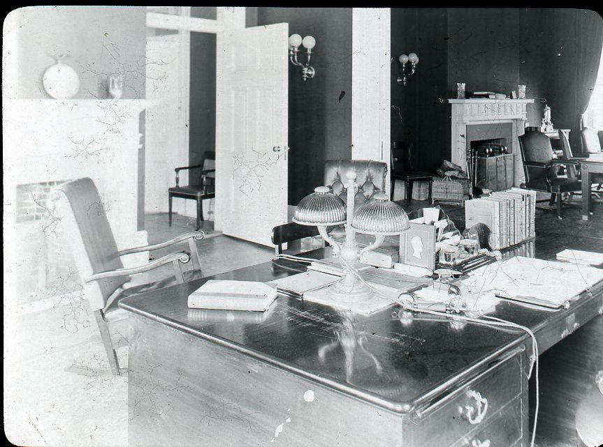 Journalists working at screens in a modern newsroom
